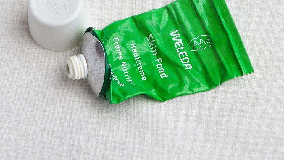 Image of green weleda glass bottles and tops